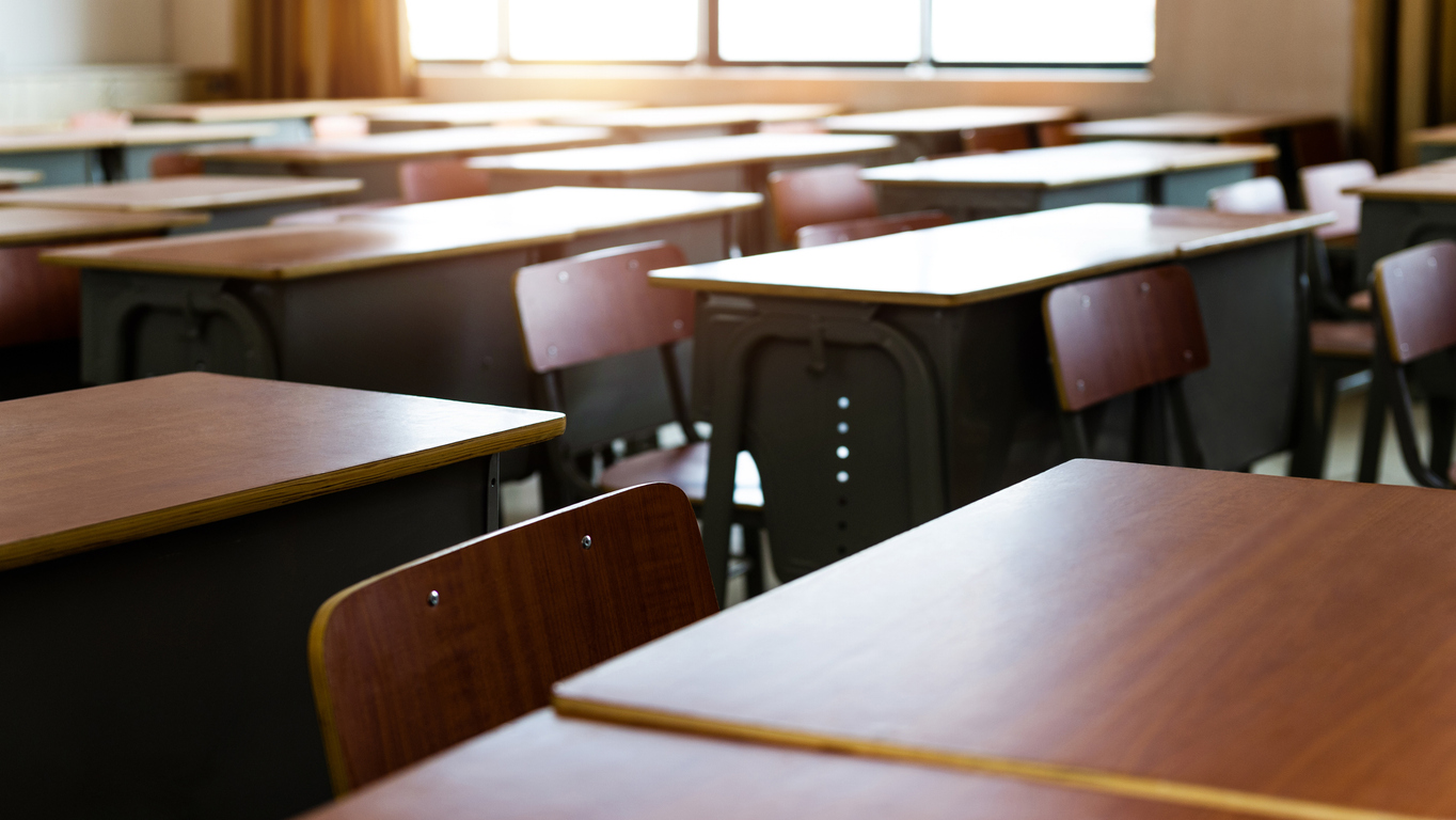Empty desks in a classroom.