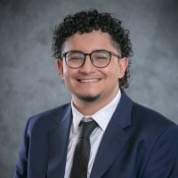 A headshot of Gerardo Estrada.