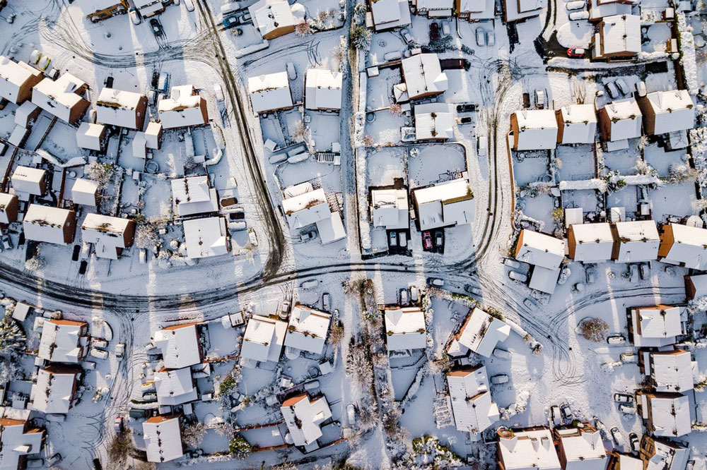 Aerial view of a snow-covered neighborhood.